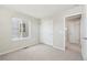 This bedroom features a sliding door closet and a window at 7312 Watercress Dr, Littleton, CO 80125
