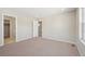 Neutral bedroom with carpet, natural light, with access to the closet and bathroom at 7312 Watercress Dr, Littleton, CO 80125