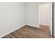 Clean, neutral bedroom with wood floors and ample natural light at 7312 Watercress Dr, Littleton, CO 80125