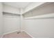 A walk-in closet with carpeted floor and a clothing rack at 7312 Watercress Dr, Littleton, CO 80125