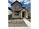 Charming two-story home featuring a modern design and inviting entrance, perfect for Gathering living at 7312 Watercress Dr, Littleton, CO 80125