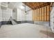 Spacious garage with high ceilings, ample space, and a side entrance at 7312 Watercress Dr, Littleton, CO 80125
