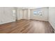 Bright and airy living room with pristine walls, gorgeous hard wood floors and natural light at 7312 Watercress Dr, Littleton, CO 80125