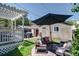 Cozy backyard with a patio, grill, and a shaded pergola-covered deck at 2941 Glenarm Pl, Denver, CO 80205