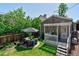 Picturesque backyard featuring a patio, well-maintained lawn, and cozy seating at 2941 Glenarm Pl, Denver, CO 80205
