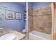 Updated bathroom with tiled shower, stylish decor, and granite vanity at 2941 Glenarm Pl, Denver, CO 80205