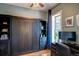 Cozy bedroom featuring a Murphy bed, workspace, and ample natural light at 2941 Glenarm Pl, Denver, CO 80205