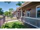 Lovely front porch with decorative flower baskets and an inviting sitting area at 2941 Glenarm Pl, Denver, CO 80205