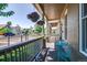 Inviting front porch with a cozy seating area and vibrant hanging flower baskets at 2941 Glenarm Pl, Denver, CO 80205
