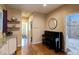 Bright hallway featuring a piano, bathroom access, and stylish shelving at 2941 Glenarm Pl, Denver, CO 80205
