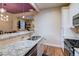Gourmet kitchen with granite counters, modern appliances, and an open layout to the dining room at 2941 Glenarm Pl, Denver, CO 80205