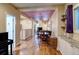 Open concept living area with hardwood floors, dining space, and bright natural lighting at 2941 Glenarm Pl, Denver, CO 80205