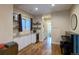 Open living room boasts a wine fridge, custom shelving and ample storage at 2941 Glenarm Pl, Denver, CO 80205