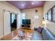 Comfortable living room featuring hardwood floors, a modern sofa, and abundant natural light at 2941 Glenarm Pl, Denver, CO 80205