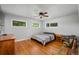 Cozy bedroom with hardwood floors and ample natural light from multiple windows at 990 S Jackson St, Denver, CO 80209