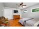 Comfortable bedroom featuring hardwood floors, a ceiling fan, and a neutral color scheme at 990 S Jackson St, Denver, CO 80209