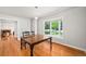 Bright dining room with a bay window and hardwood flooring at 990 S Jackson St, Denver, CO 80209