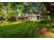 A front yard of a home with a large green lawn at 990 S Jackson St, Denver, CO 80209