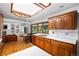 Charming kitchen with wood cabinets, countertops, and a large window at 990 S Jackson St, Denver, CO 80209