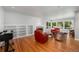 Bright living room with fireplace, built-in shelving, and large windows at 990 S Jackson St, Denver, CO 80209
