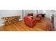 Open-concept living room with hardwood floors and stylish decor at 990 S Jackson St, Denver, CO 80209