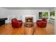 Cozy living room featuring a fireplace and comfortable seating arrangement at 990 S Jackson St, Denver, CO 80209