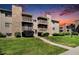 Well-maintained condo complex featuring stone accents, private balconies and landscaped grounds at 381 S Ames St # G101, Lakewood, CO 80226
