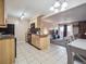 Inviting kitchen with a breakfast bar and views of the living area at 381 S Ames St # G101, Lakewood, CO 80226