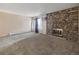 Spacious living room with stone fireplace and natural light at 381 S Ames St # G101, Lakewood, CO 80226