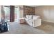 Bright living room featuring large window, stone fireplace, and comfortable seating at 381 S Ames St # G101, Lakewood, CO 80226