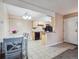 Open-concept living space featuring a dining area and an adjacent kitchen at 381 S Ames St # G101, Lakewood, CO 80226