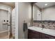Neutral bath design, with decorative backsplash, tiled floors, walk-in shower and floating vanity at 5790 Fox Run Ct, Parker, CO 80134