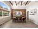 Bright dining room with wood-look floors and wooden beams at 5790 Fox Run Ct, Parker, CO 80134