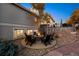 Outdoor fire pit with Adirondack chairs surrounded by lovely landscaping for entertaining at 5790 Fox Run Ct, Parker, CO 80134