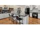 A kitchen island with granite countertop with seating at 5790 Fox Run Ct, Parker, CO 80134