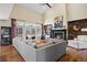 Inviting living room featuring a fireplace, high ceilings, and a comfortable sofa at 5790 Fox Run Ct, Parker, CO 80134