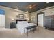 Large main bedroom with neutral tones, carpet, ceiling fan, and ample space for comfortable living at 5790 Fox Run Ct, Parker, CO 80134
