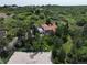 Expansive property with a tennis court, large home and surrounding lush landscape at 326 E Oak Hills Dr, Castle Rock, CO 80108