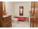 Charming bathroom featuring a vintage red clawfoot tub and stylish wood vanity at 326 E Oak Hills Dr, Castle Rock, CO 80108