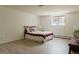 Bright bedroom with light wood floors, a window view, and comfortable furnishings at 326 E Oak Hills Dr, Castle Rock, CO 80108