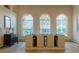 Elegant dining room featuring decorative windows that provide unique natural lighting at 326 E Oak Hills Dr, Castle Rock, CO 80108