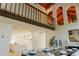 Open-concept dining area with high ceilings, exposed beams, and large arched windows at 326 E Oak Hills Dr, Castle Rock, CO 80108
