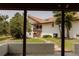 View of the home featuring stucco walls, a tile roof, and mature trees at 326 E Oak Hills Dr, Castle Rock, CO 80108