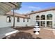 Stunning home exterior showcasing a fountain and large windows that provide natural light at 326 E Oak Hills Dr, Castle Rock, CO 80108