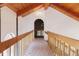 Hallway with wood railing and wood-beam ceiling at 326 E Oak Hills Dr, Castle Rock, CO 80108