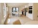 Open-concept kitchen with a spacious island, white cabinets, and stainless steel appliances at 326 E Oak Hills Dr, Castle Rock, CO 80108