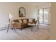 Bright living room with neutral colors, a stylish sofa, and a sliding glass door at 326 E Oak Hills Dr, Castle Rock, CO 80108