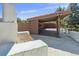 Outdoor space with a partially covered wooden deck, grill, and concrete perimeter at 326 E Oak Hills Dr, Castle Rock, CO 80108