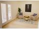 Cozy sitting area featuring French doors, a stylish rug, and comfortable seating at 326 E Oak Hills Dr, Castle Rock, CO 80108