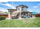 Backyard features a patio, a pergola, a grill and manicured green grass at 15776 E 107Th Way, Commerce City, CO 80022